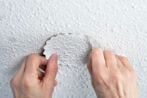 How do you fix water damage on a popcorn ceiling?